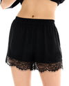 Close-up front view of black shorts showing the elasticated waistband and Chantilly lace detail.