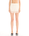 Cream pull-on shorts shown from the front with an elasticated waist and Chantilly lace hem.