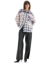 A model wears The Tales Patched Up Western Shirt in Cream with black wide-leg trousers in a full-length front view.