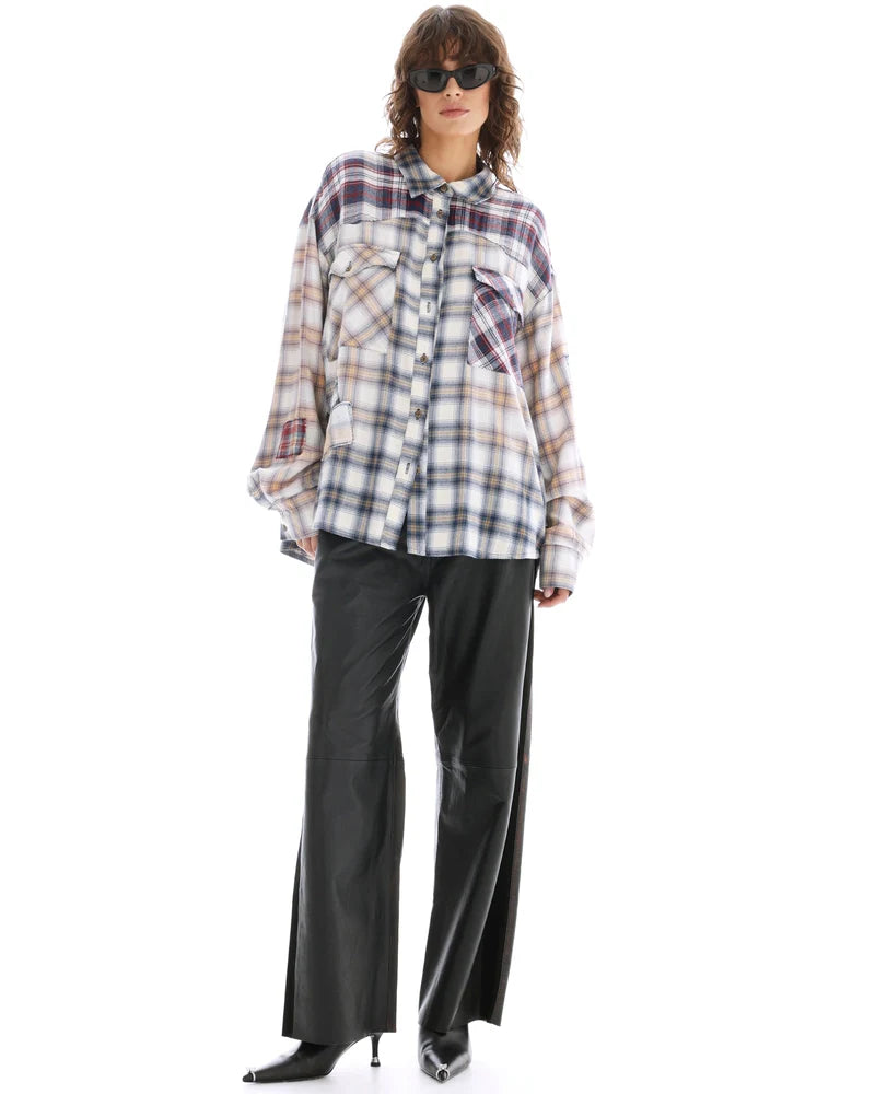 A model wears the oversized cream mixed-plaid shirt in a full-length front view.