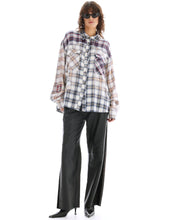 A model wears the oversized cream mixed-plaid shirt in a full-length front view.