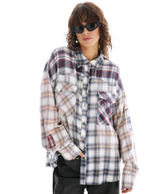 A model wears the cream button-through shirt in a three-quarter front view showing the contrasting chest pockets.