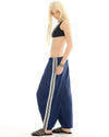 The Tales The Harajuku track Pant — the Harajuku Track Pant by The Tales Contemporary Unisex wide leg track pants with contrast stripe tape.