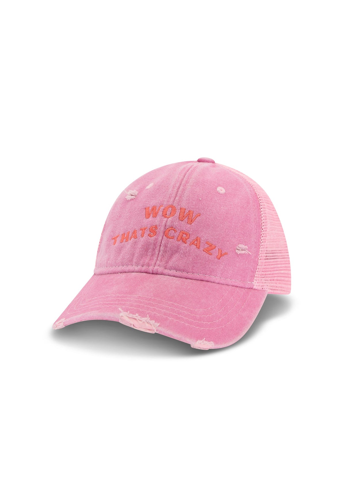 Three-quarter product view of the pink trucker cap showing the embroidered front slogan, distressed peak and mesh side panel.