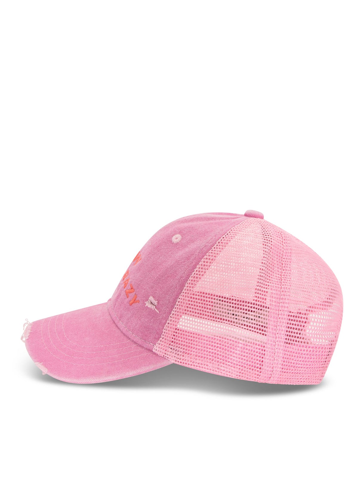Side product view showing the curved peak, distressed cotton front and breathable pink mesh back.