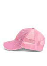 Side product view showing the curved peak, distressed cotton front and breathable pink mesh back.
