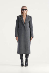 A Single breasted mid calf length wool coat by Elka Collective. The perfect winter staple, the Alba Coat features, a front panel seam, hip pockets and a traditional lapel with single button front fastening. 