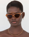 Velvet Canyon Beat Generation Sunglasses in Amber Tort — it’s a cool night but your skin tingles like fire, your heels echo off the walls of the alley you’re making your way down.