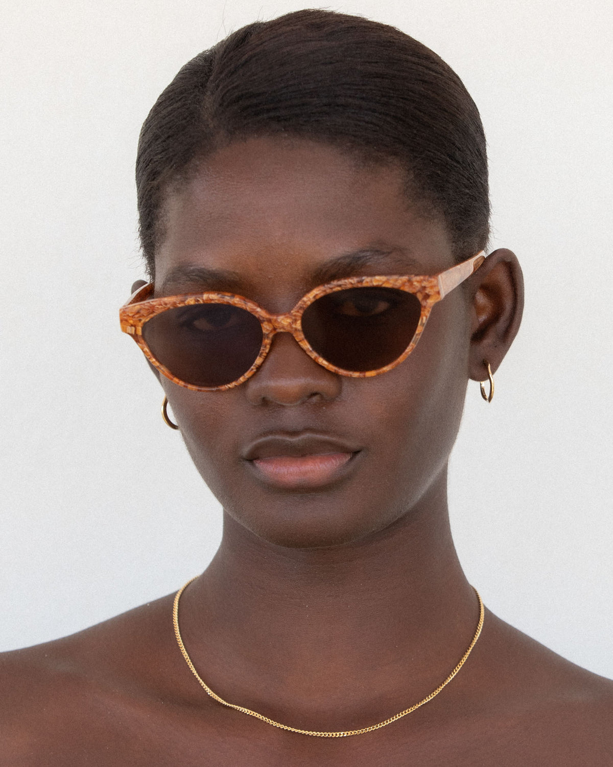 Velvet Canyon Beat Generation Sunglasses in Amber Tort — it’s a cool night but your skin tingles like fire, your heels echo off the walls of the alley you’re making your way down.